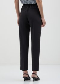 Calliope TINTA UNITA - Stoffhose - nero
