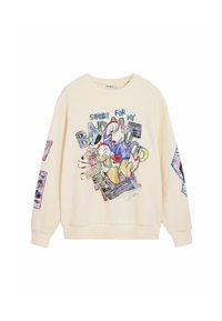 Sweat-shirt beige présentant un graphisme de Donald Duck en train de donner un coup de poing avec le texte « Désolé pour ma mauvaise humeur » et des patchs en style collage sur les manches.