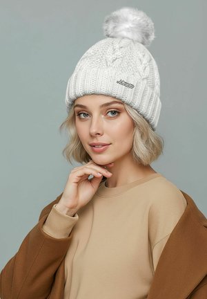 White knitted beanie with a ribbed design and a gray pom-pom on top. Features a small silver logo detail on the front.