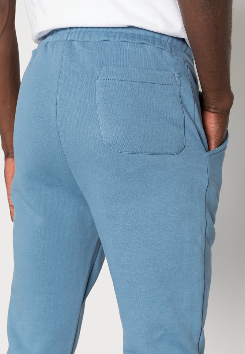 Herren Trainingsanzüge | Alpha Industries ORGANICS JOGGER Jogginghose organic petrol/petrol - SU63864 Herren Trainingsanzüge | Alpha Industries ORGANICS JOGGER Jogginghose organic petrol/petrol - SU63864