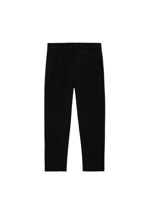 - Spodnie materiałowe