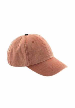 Faded pink fabric baseball cap with stitched panels, ventilation holes, and curved brim isolated on white background.