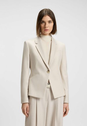 Beige tailored blazer made of smooth fabric, featuring a single button closure, notched lapels, and front side pockets.