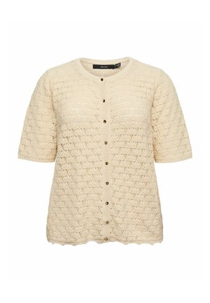 Cardigan en tricot beige crème à manches courtes, col rond, ourlet festonné et fermeture boutonnée devant avec petits boutons foncés.