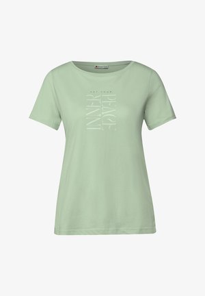 Camiseta de manga corta color verde menta, hecha de tela suave. Presenta un diseño gráfico vertical en blanco que dice "ENCUENTRA TU PAZ INTERIOR."