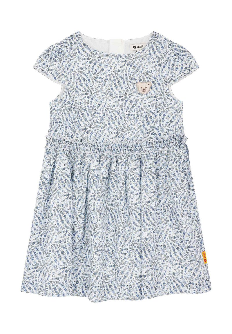 Robe en coton à fleurs bleu clair avec des manches courtes, jupe plissée et un patch en forme d'ours en peluche sur la poitrine. Dispose d'une fermeture à l'arrière.
