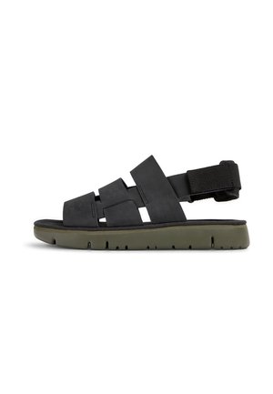 Black sandal with multiple wide straps across the upper, a cushioned footbed, and an olive green rubber sole. Adjustable ankle strap included.