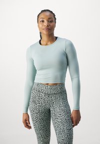 Casall CROP LONG SLEEVE - Pikkade varrukatega topp - mellow mint