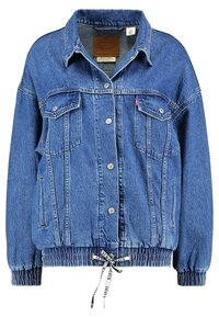 Blue denim jacket with button front, two chest flap pockets, elastic cuffs, and adjustable drawstring hem with branded ties.