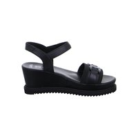 Black wedge sandal with ankle strap, front strap featuring decorative buckle, and ridged sole for added traction.
