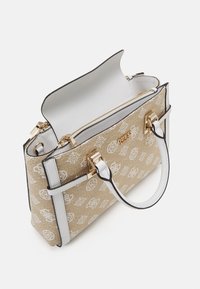 Beige patterned handbag with white accents, gold hardware, and a zip closure. Features dual handles and a structured design.
