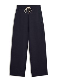 Námorníckomodré bavlnené tepláky s voľným strihom, elastickým pásom a krémovou šnúrkou na stiahnutie. Obsahujú bočné vrecká a prešívaný lem.