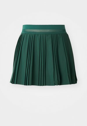 Grüne plissierte Rock mit glatter Textur, ausgestattet mit einem breiten Bund und gleichmäßigen Falten für einen strukturierten Look.