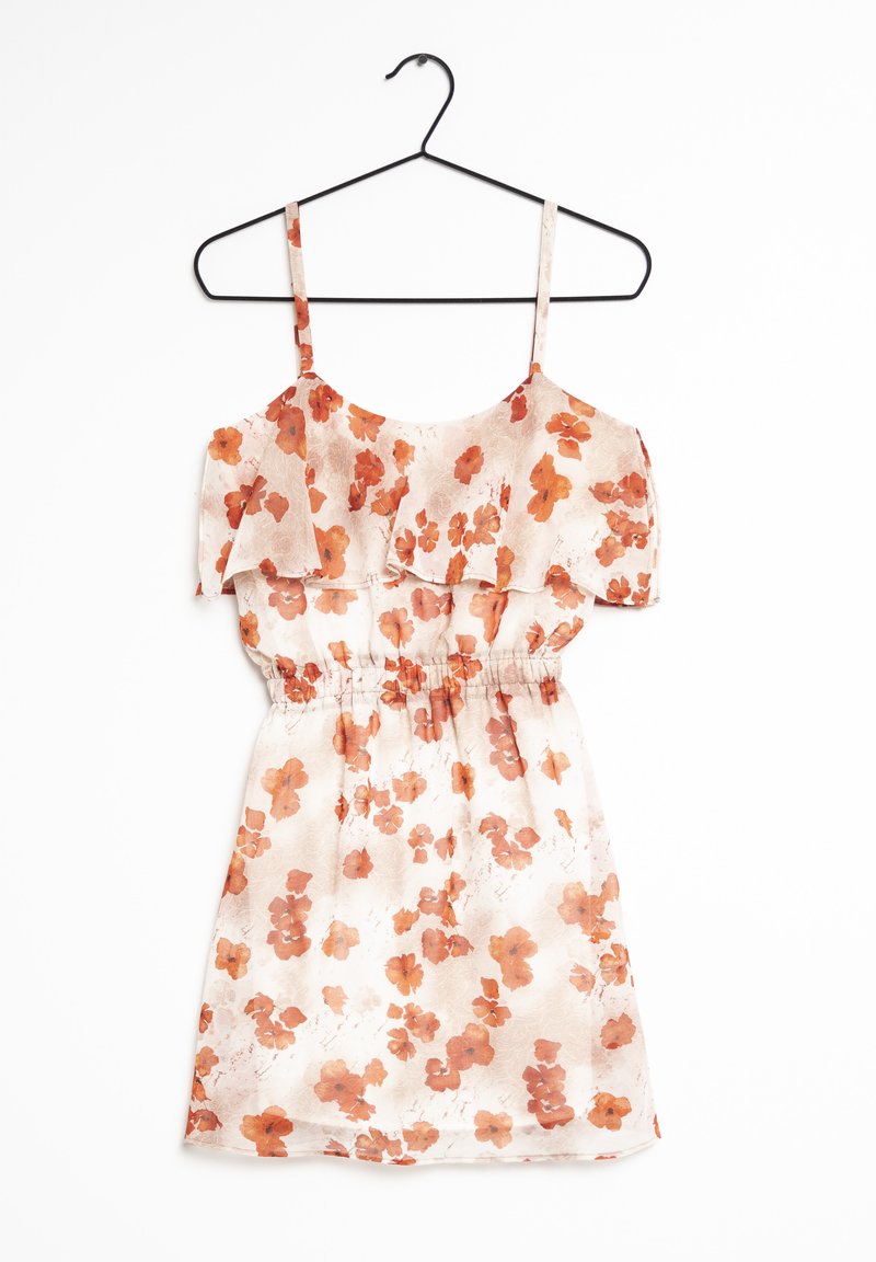 Bloementuniek met een lichte, doorzichtige stof en een elastische tailleband. Het kleurenpalet omvat zacht beige met oranje bloemen en gerimpelde schouderbanden.