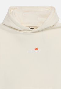 Krémová mikina s kapucňou, na ktorej je veľké logo na hrudi s červeným a oranžovým akcentom. Mäkkučká tkanina s klasickým dizajnom kapucne.
