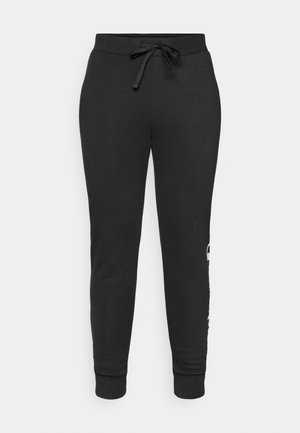 Pantalons de jogging noirs fuselés avec taille à cordon, fabriqués en tissu doux. Présentent des poignets côtelés et un détail de logo imprimé sur le côté.