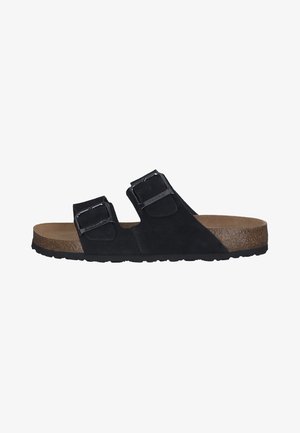 Black suede sandal with two adjustable straps, silver buckles, cork footbed, and textured rubber outsole. Semi-open design.