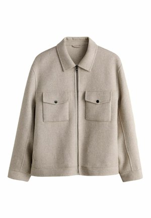 Jachetă de lână bej cu fermoar frontal, două buzunare la piept cu nasturi, mâneci lungi și guler clasic.
