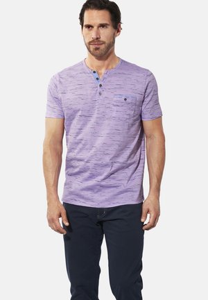 Short-sleeve lavender cotton T-shirt with a textured pattern, three-button placket, and a small chest pocket.