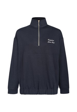 Tamsiai mėlynas zip-up džemperis, pagamintas iš minkštos medžiagos, su aukštu apykakle, elastinga apačia ir balta siuvinėta "Carpintero Sports Club" užrašu.