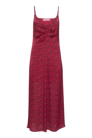 Rózsaszín virágmintás ruha ujjatlan kialakítással, elcsavart elülső résszel és folyékony szoknyával, amely a vádli közepéig ér.