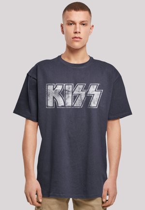 Dark navy oversized t-shirt made of cotton featuring a distressed white "KISS" logo in bold lettering across the chest. Short sleeves, crew neck.