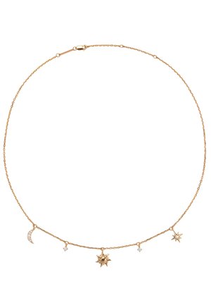 Delicate gold chain necklace with sun, crescent moon, star charms, and small diamond-like stones evenly spaced along the chain.