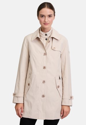 Light beige raincoat with a collar, front buttons, two side pockets, and a quilted inner layer. Smooth texture with minimal detailing.