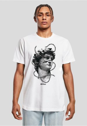 White cotton t-shirt featuring a black and gray graphic of a sculpted head surrounded by barbed wire, with the text "I'm a Sinner" at the bottom.