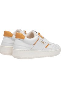 White leather sneakers with a textured orange suede heel, flat white rubber sole, and contrasting detailing. Label reads "MoEa."