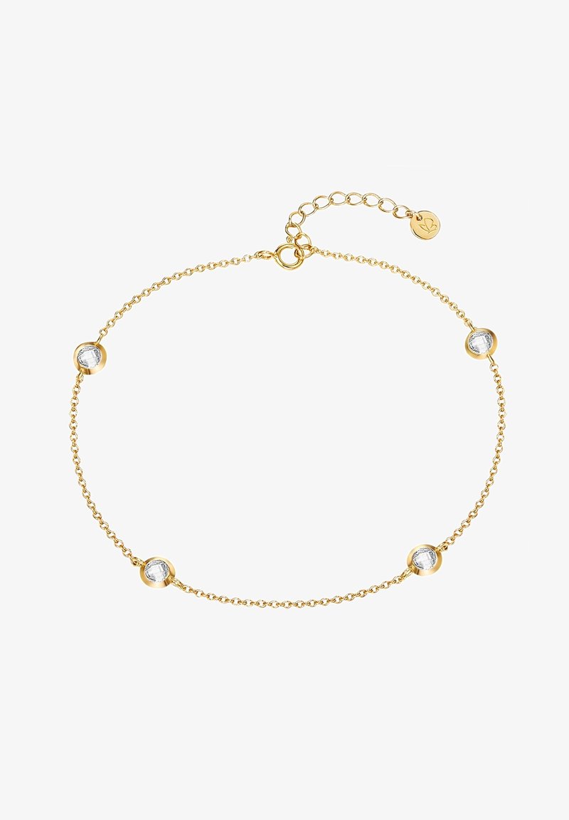 Zelta ķēdes aproce ar četriem apaļiem, caurspīdīgiem dārgakmeņiem, kas ierāmēti apaļās zelta akcentos. Regulējama aizdare ar ķēdes pagarinājumu izmēra pielāgošanai.