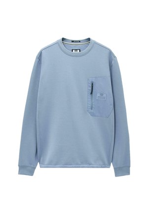 Light blue long-sleeve sweatshirt with a zippered chest pocket and "Weekend Offender" logo patch on the pocket.