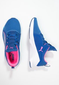 Blue athletic shoes with mesh upper, pink accents, padded collar, and perforated details. Features white rubber sole for traction and support.