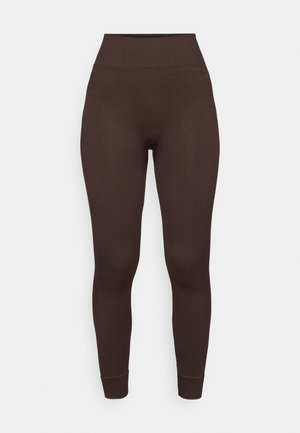 Brown ribbed leggings with a high waist and fitted design. The fabric appears soft with a smooth texture at the hem and ankle cuffs.