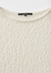 Cream-colored knitted sweater with a rounded neckline and a black size label reading "someday. 36" attached inside the collar.