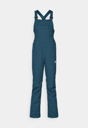 Teal lumppuku hyytelö, jossa on säädettävät hihnat, vetoketjullinen rintatasku ja kaksi sivutaskua, valmistettu kestävästä säänkestävästä materiaalista.