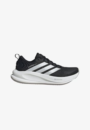 Chaussure de course Adidas Supernova Ease 2 noire avec trois bandes blanches et semelle épaisse blanche amortissante étiquetée Dreamstrike, vue de côté.