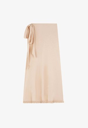 Beige wrap skirt made of soft fabric with a textured surface, featuring a tied accent on one side and a fringed hem at the bottom.