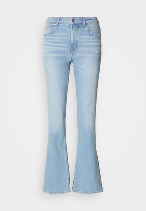 Helle blaue Schlagjeans aus Denim mit hoher Taille, die eine dezente Ausbleichung und einen klassischen Reißverschluss hat.