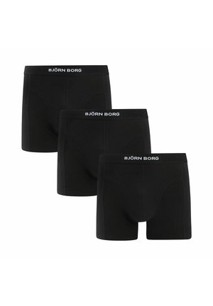 Drie zwarte Björn Borg boxershorts met gebrande elastische taillebanden, afgebeeld tegen een witte achtergrond.