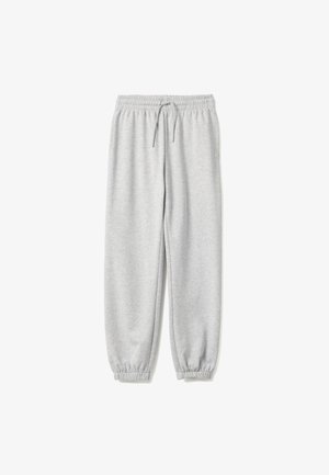 Lichtgrijze joggingbroek met elastische tailleband en boorden, voorzien van een voorste trekkoord voor een verstelbare pasvorm, plat gelegd op een witte achtergrond.