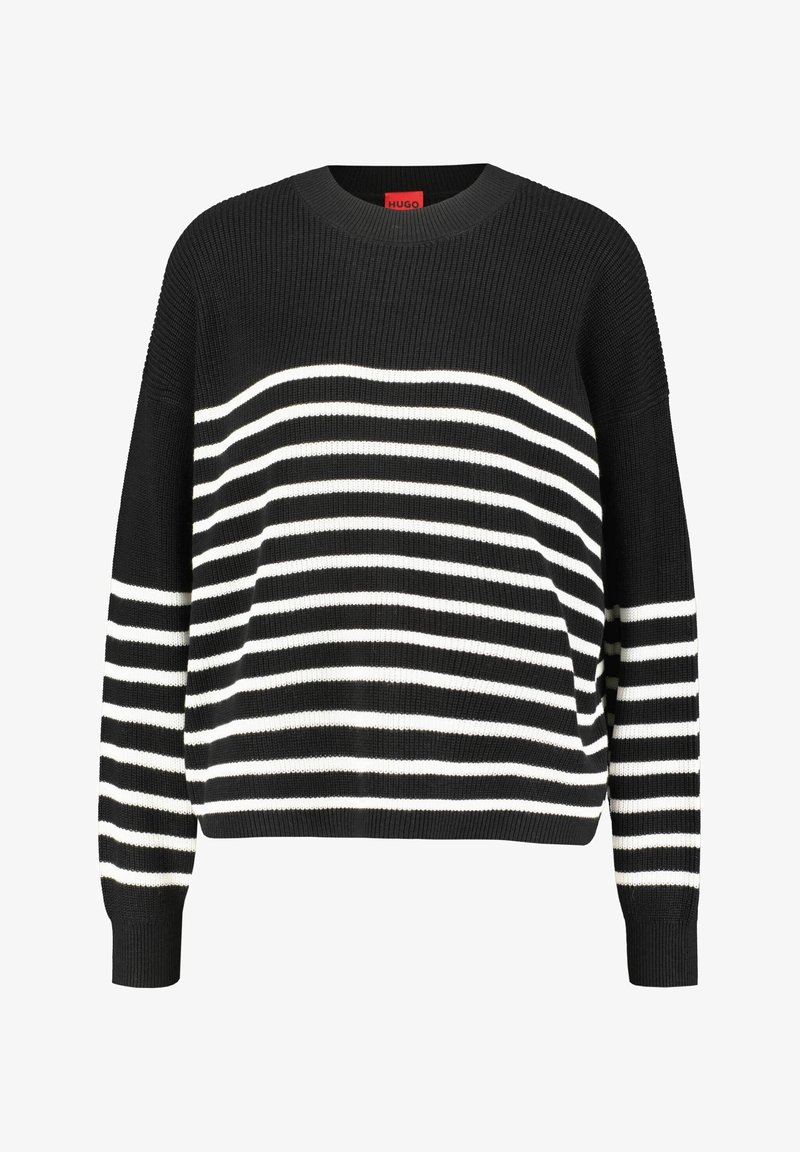 Pull rayé noir et blanc avec une texture côtelée, un col arrondi et des manches longues. Les rayures horizontales varient en largeur. Étiquette de la marque visible.