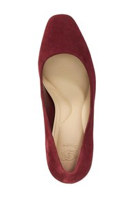 Red suede high heel pump with a square toe design and a smooth beige insole. The shoe has a soft texture and a minimalistic look.