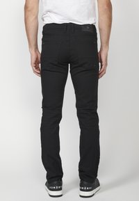 Koroshi STRETCH  - Vaqueros rectos - black