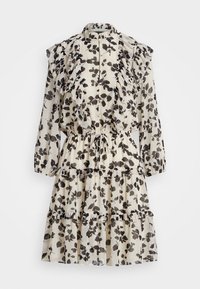 Blommig klänning med volangiga axlar, krämfärgad bakgrund och svart lövmönster. Har en figursydd midja och design med lagerkjol.