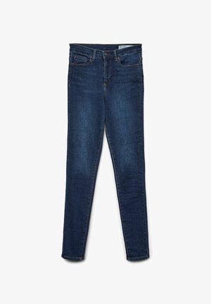 Skinny fit jeans in dark blue denim. Features five-pocket design, zipper fly, and belt loops. Smooth texture with subtle color variation.