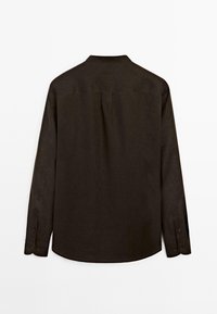 Long-sleeve shirt in dark brown fabric with a collared neckline, button cuffs, and a slightly curved hem. Back view shows clean lines and no patterns.