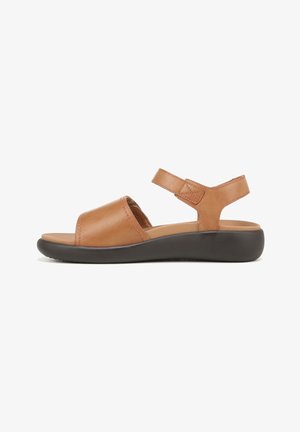 Brown leather sandal with a wide strap across the toe and adjustable ankle strap. Features a cushioned footbed and a black rubber sole.