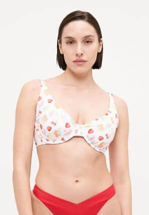 White bikini top featuring a floral pattern with strawberries and peach shapes. Structured design with wide straps and gathered fabric.