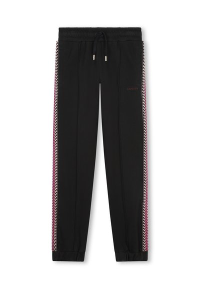 Pantalons de jogging noirs avec une taille à cordon, ornés de rayures en zigzag roses et blanches sur les côtés et de poignets élastiques aux chevilles.